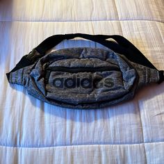 Adidas Waist Bag. Fanny Pack. Never Used. Brand New. Perfect Condition. Light Weight. Waterproof. One Size Sold. Adjustable. Black/Gray Color. Original Adidas. Casual Gray Bag With Adjustable Strap, Casual Gray Pouch Shoulder Bag, Casual Gray Bags, Sporty Gray Shoulder Bag For Travel, Casual Gray Pouch Bag, Sporty Gray Sports Bags, Sporty Gray Bags For Daily Use, Original Adidas, Original Bags