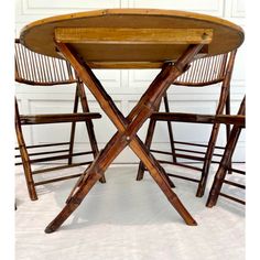 Here is an amazing dining set made from burnt or tortoise shell finish bamboo.  The set consists of a round table and four matching chairs.  All the pieces fold up!  It's perfect for daily use or used for special occasions.   The chairs have lovely rounded backs with wonderful wrapped corners and slatted design.  The table is topped with a geometric burnt bamboo top and trimmed in bamboo pieces.  It's lightweight but sturdy!    Table is 36 diameter 30”h, knee is 29.5” Chairs 18.5 x 25 x 35 Seat height 18” Round Dining Table And Chairs, Bamboo Chairs, Bamboo Chair, Dining Table And Chairs, Bamboo Top, Matching Chairs, Dining Table Chairs, Folding Chair, Round Table