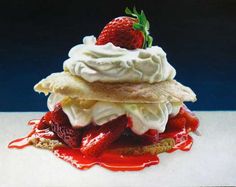 a strawberry shortcake with whipped cream and strawberries on top is sitting on a white surface