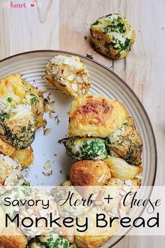 a plate filled with baked goods and the words savory herb cheese monkey bread