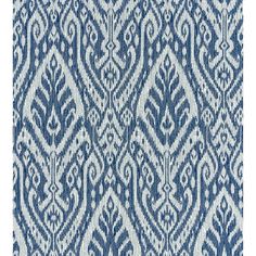 a blue and white rug with an intricate design