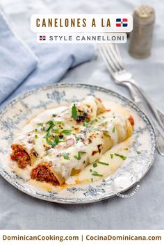 a close up of a plate of food on a table with a fork and knife