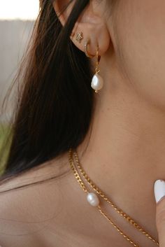 These small pearl drop hoops earrings are perfect for a classic and elegant look, they are made of 18k gold plated stainless steel. I particularly love these earrings for a bride/wedding occasion! Sold in pairs ITEM DETAILS Water Resistant- skin-friendly-Tarnish-free Material: 18k Gold plated stainless steel hoops Freshwater Pearls **Sizes: Small Hoop Diameter 0.59 in - 15mm Jewelry Care We at Alma Libre Jewelry understand that every person is different and we each have unique skin-oils that may Everyday Teardrop Pearl Pendant Earrings, Elegant Gold Plated Huggie Earrings With Pearl Drop, Elegant Gold-plated Huggie Earrings With Pearl Drop, Classic Teardrop Pearl Chain Earrings, Elegant Gold Plated Huggie Pearl Earrings, Gold Plated Teardrop Pearl Earrings, Gold-plated Teardrop Pearl Earrings, Classic Dangle Hoop Earrings With Pearl Charm, Classic Gold Plated Hoop Earrings With Pearl Drop