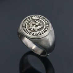 "❥ All of our cargoes are sent by express shipment. Cargoes can be delivered to Europe within 1-2 days after product preparation, to USA and Canada within 2-4 days, to Australia, Asian- Othe American countries and other regions within 3-5 days. US Navy Eagle Embossed Ring, USA Eagle Ring, Silver Military Ring, Personalized Military Ring, Force Ring ☞ ☞ ☞ ITEM DESCRIPTION ☜ ☜ ☜ * Material : 925 Sterling Silver (stamped) * Weight : Around 16 GR * Ring Face Size : 20x20 MM * Color & Plating Opt Usa Eagle, English Jewelry, Navy Aircraft Carrier, Eagle Ring, Navy Aircraft, Sterling Silver Initial, United States Navy, Round Rings, Aircraft Carrier