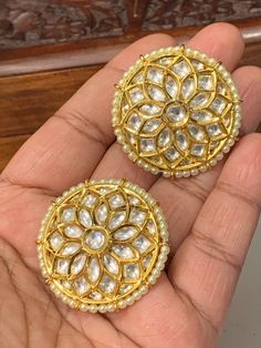 Gold plated tyanni kundan stud earring. About 1.25 inch in diameter. Clip and push back. Bollywood Style Kundan Yellow Gold Earrings, Bridal Kundan Earrings With Cutdana In Round Shape, Gold Kundan Round Bead Earrings, Gold Dual-tone Kundan Earrings, Dual-tone Kundan Earrings, Ruby Jewelry, Stud Earring, Gold Earrings, Ruby