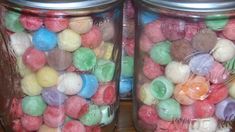 two glass jars filled with different colored candies