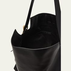 Wandler "Marli" tote bag in leather Adjustable shoulder strap Fold-over flap top with magnetic closure  Lining: Cotton Approx. 8.7"H x 9.8"W x 3.9"D Made in Italy Black Leather Tote Bag, Bergdorf Goodman, Leather Tote Bag, Magnetic Closure, Leather Tote, Top Designers, Tops Designs, Shoulder Strap, In Italy