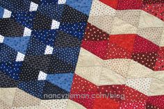 an american flag quilt is shown in red, white and blue