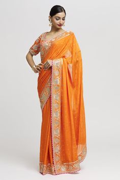 Orange saree with sprinkled buttis and floral border. Comes with zardozi embroidered backless, padded blouse. - Aza Fashions Gopi Vaid, Orange Saree, Padded Blouse, Border Saree, Orange Blouse, Floral Border, Sarees Online, Aza Fashion, Saree Designs