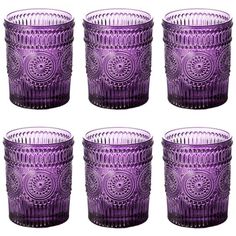 six purple glass tumblers sitting next to each other