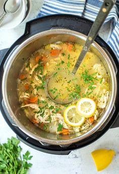 a pot filled with chicken and lemon soup