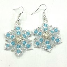 Gorgeous Handmade Snowflake Earrings With Blue And White Preciosa Crystals And White And Clear Seed Beads With A Swarovski Pearl Bead In The Center. Finished With Hypoallergenic Stainless Silver Ear Hooks. Can Be Converted To Clip On If Requested. Perfect For The Holidays And Holiday Parties. Festival Party Christmas Winter Holidays Gift Hand Crafted Handcrafted By Me So Each Piece Is One Of A Kind. Your Order Is Beautifully Packaged With Care And Shipped The Same Or Next Business Day. White Tassel Earrings, Kitten Earrings, Flamingo Earrings, Natural Stone Earrings, Bead Sewing, Snowflake Earrings, Statement Drop Earrings, Easy Dinners, Earrings Blue