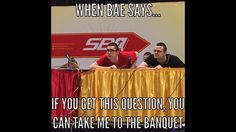 two men sitting at a table with a sign behind them that says when bake says if you get this question, you can't take me to the banquet