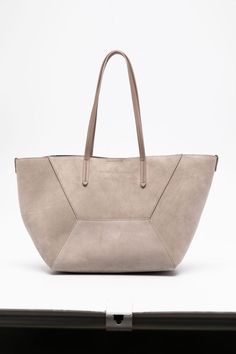 taupe grey calf suede panelled design debossed logo to the front signature Monili chain detail two flat top handles main compartment removable pouch leather lining concealed magnetic fastening This piece comes complete with a protective dust bag. Taupe Soft Leather Work Bags, Modern Top Handle Bag With Suede Lining, Beige Leather Bags With Suede Lining, Elegant Gray Textured Leather Shoulder Bag, Modern Taupe Bag With Textured Leather, Modern Bags With Suede Lining For Work, Beige Bag With Suede Lining For Everyday Use, Chic Tote Bag With Suede Lining, Chic Beige Suede Bag