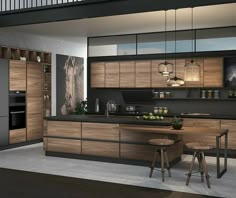 a modern kitchen with wooden cabinets and black counter tops, along with stools on the floor