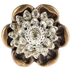 an image of a ring that is made out of gold and crystal stones with a flower design