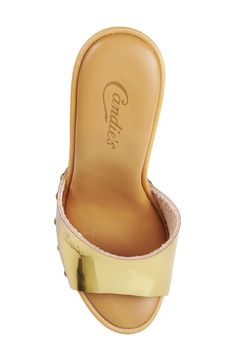 A clog-inspired stud strap tops this versatile slide sandal that's raised on a lofty heel. 4 1/4" heel; 3/4" platform Cushioned insole Leather, textile or synthetic upper/leather lining/synthetic sole Imported Summer Synthetic Clogs With Heel Strap, Summer Party Clogs In Synthetic Material, Gold Mules With Removable Insole And Open Heel, Gold Open Heel Mules With Removable Insole, Gold Open Heel Mules With Heel Loop, Gold Leather Open Toe Slides, Summer Open Toe Clogs With 4-inch Heel, Gold High Heel Synthetic Mules, Gold Slip-on Slides With Leather Footbed