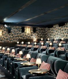 rows of chairs with lamps on them in a room