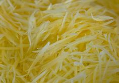 shredded cheese is shown in close up view