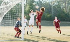 a group of young men playing a game of soccer