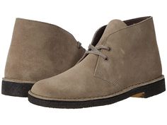 Clarks Desert Boot - Men's Lace-up Boots : Grey Suede : Please note: colors may look a little lighter in photo due to professional studio lighting. Stylish and versatile, the original Clarks Desert Boot launched in 1950 by Nathan Clark and was inspired by a rough boot from Cairo's Old Bazaar. An instant hit, it became the footwear of choice for off-duty army officers. Premium leather is teamed with an unfussy lace fastening and our signature crepe sole. Soft, supple suede and full grain leather Classic Outdoor Boots With Suede Lining, Classic Desert Boots With Reinforced Heel, Classic Ankle Desert Boots With Reinforced Heel, Classic Desert Boots With Rubber Sole For Fall, Classic Outdoor Desert Boots With Round Toe, Classic Ankle Desert Boots, Clarks Desert Boots Men, Mens Lace Up Boots, Clarks Desert Boot