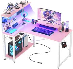 a computer desk with two monitors and headphones sitting on it's top shelf