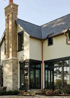 a large white house with black trim and windows