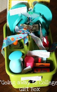 a green container filled with school supplies on top of a wooden floor