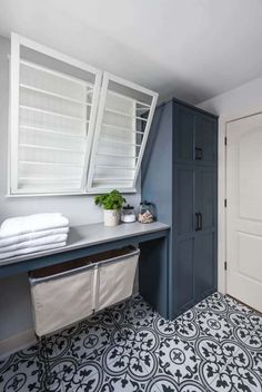 the bathroom is clean and ready to be used as a room divider for towels