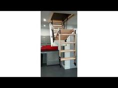 there is a staircase in the middle of this room with shelves and drawers on both sides