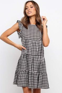 Tiered swing dress with ruffle sleeves in a classic plaid. Light material perfect for summer Short Black Gingham Dress, Ruffled Mini Dress, Sunday Dress, Flowy Mini Dress, Ruffle Sleeve Dress, Ruffle Mini Dress, Office Business, Dresses By Length, Flutter Sleeve Dress