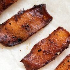 three pieces of meat sitting on top of a piece of paper with the title mushroom bacon