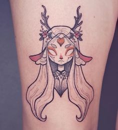 a woman with long hair and horns on her head is depicted in this tattoo design