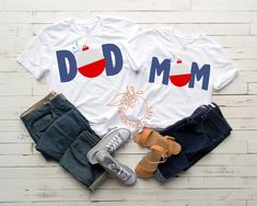 two t - shirts with the words dad and mom printed on them next to shoes