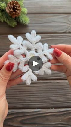 someone is holding up a snowflake ornament in their hand with the video below it