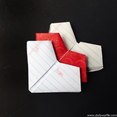 three origami envelopes sitting on top of each other