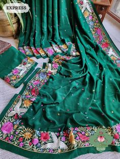 Update! - Zynah covered by LBB - https://lbb.in/bangalore/zynah-designs-handloom-sarees/ Introducing our Green Pure Crepe Silk Hand Embroidered Parsi Gara Saree, a stunning masterpiece that is sure to captivate your heart. Adorned with intricate Parsi Gara embroidery, this saree features a beautiful combination of border and all-over multi-color polkas that add a playful and cheerful vibe to the overall design. The pure crepe silk material lends a luxurious feel to the saree, making it perfect for special occasions. Drape it around yourself and feel the exquisite craftsmanship and attention to detail that has gone into creating this beauty. Let this authentic vintage art saree /heirloom piece bring out the diva in you and leave everyone in awe. This is a completed hand-made saree and usual Green Silk Fabric With Floral Embroidery, Green Raw Silk Fabric With Floral Embroidery, Green Floral Embroidered Raw Silk Fabric, Green Intricately Embroidered Fabric For Traditional Ceremonies, Traditional Green Saree With Floral Embroidery, Green Embroidered Bohemian Saree, Bohemian Embroidered Green Saree, Embroidery Saree, Indian Embroidery