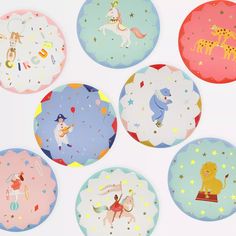 six paper plates with different designs and animals on them, all in pastel colors