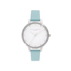 a pop of turquoise meets rainbow sparkles in this statement timepiece. our first ever turquoise strap makes a cool contrast with one of our most dazzling bezels yet. a ring of sustainably-sourced rainbow swarovski crystals frame a classic white demi dial, showing off the delicate crystal markers. simply look down at your wrist when you need a little lift Olivia Burton Watch, Blue Watches, Rainbow Necklace, Turquoise Leather, Rainbow Crystal, Olivia Burton, Rose Gold Watch, Crystals And Gemstones, Blue Leather