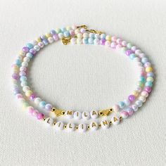 This pastel mermaid necklace is strung on very sturdy wire with iridescent faux pearl beads with your child's name spelled out in gold letter beads accentuated with 18K gold hearts or 18K gold ball beads.  If you need a gift for your daughter, girls birthday gift, granddaughter gift, friends daughter, Niece Gift, or Easter Gift, this beautiful necklace is the right choice!  It is an adorable personalized gift that will surely bring smiles.  Choose which style you would like from the drop down me Cheap Letter Beads Necklace For Birthday, Cheap Letter Beads Necklace For Birthday Gift, Cheap Customizable Beaded Necklaces For Gifts, Cheap Personalized Beaded Necklaces As Gifts, Cheap Personalized Beaded Necklaces For Gifts, Cheap Personalized Beaded Necklace For Gift, Fall Necklaces For Kids, Preschool Name Necklace, Kids Pearl Necklace Children