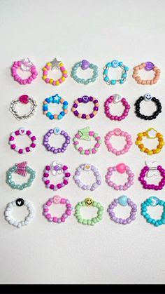 many different types of bracelets on a white surface