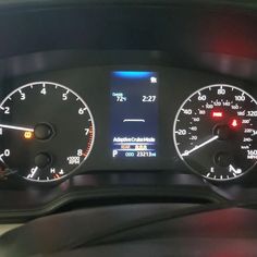 the dashboard of a car with two speedometers