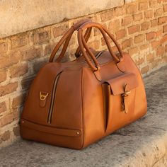 Luxe Travel Duffle in Cognac Painted Calf by DapperFam – DapperFam.com Luxury Large Capacity Shoulder Bag For Overnight Trips, Luxury Luggage For Overnight Trips With Top Carry Handle, Luxury Shoulder Bag With Luggage Sleeve For Overnight Trips, Luxury Duffle Bag Tote For Overnight Trips, Luxury Tote Duffle Bag For Overnight Trips, Luxury Luggage For Travel With Large Capacity, Luxury Luggage For Overnight Trips With Large Capacity, Luxury Leather Trim Duffle Bag For Overnight Trips, Luxury Duffle Bag With Leather Handles For Weekend Trips