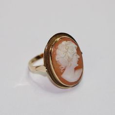 SKU: 0057 A beautiful cameo fancy ring set in 14ct yellow gold. This pretty ring would be perfect for any and every occasion. Size: UK: K 1/2 American: 5 1/2 Continental: 10 1/2 This is a vintage item and such has wear. There may be some superficial scratches, otherwise the item is good condition. This item comes beautifully boxed in our own packaging. Processing time for orders is 1-3 business days. Vintage 14k Gold Cameo Rings, Cameo 14k Gold Rings For Collectors, Vintage Cameo Signet Ring, Collectible 14k Gold Cameo Rings, Vintage Oval Cameo Ring, Fine Jewelry Cameo Wedding Ring, 14k Gold Cameo Rings For Collectors, Fine Jewelry Cameo Rings For Weddings, Victorian Gold Cameo Rings