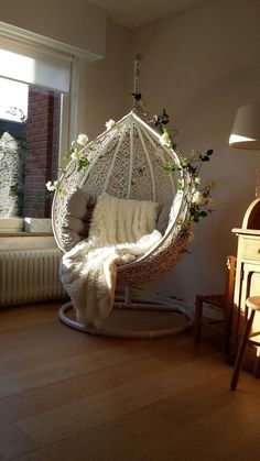 a hammock hanging from the ceiling in a living room