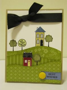 a card with a house on it and a black ribbon around the edge that says best wishes