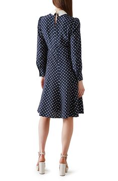 Decorative buttons add a touch of sparkling sophistication to a long-sleeve silk dress featuring bright polka dots and a contrasting point collar. Hidden back-zip closure Point collar Long sleeves with button cuffs 100% silk Dry clean Imported This brand is certified with the Butterfly Mark, which identifies luxury brands that adhere to social and environmental best practices
 This brand meets Nordstrom Responsible Brands criteria: brand adheres to responsible social and environmental practices Silk Dress With Button Closure For Fall, Silk Dresses With Button Closure For Fall, Classic Silk Dresses With Buttons, Silk Button-up Dresses For Daywear, Polka Dot Button-up Dress With Buttons, Polka Dot Button-up Dress, Fitted Polka Dot Dress For Daywear, Fitted Long Sleeve Midi Dress With Button Cuffs, Silk Polka Dot Spring Dress