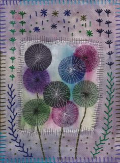 an art quilt with four purple and green dandelions