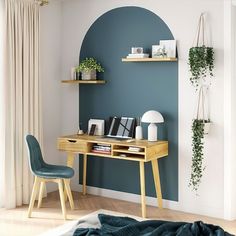 a desk and chair in a room with blue walls, wooden flooring and shelves on the wall