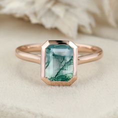 Experience nature's elegance with our 8x6mm Emerald Cut Moss Agate Bezel Solitaire Engagement Ring, a perfect gift for women who appreciate the beauty of the natural world. Bezel Solitaire Engagement Ring, Engagement Ring Bezel, Agate Rings, Moss Agate Engagement Ring, Bezel Engagement Ring, Agate Engagement Ring, Moss Agate Ring, Ring Bezel, Promise Ring Gift